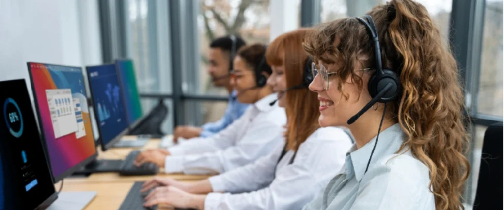 Inbound call center services team handling customer support calls in a professional office setting