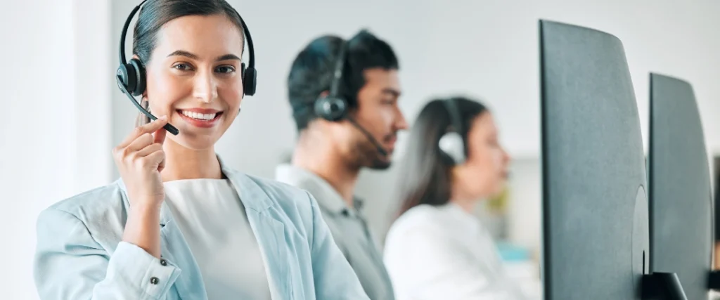 Customer service outsourcing team reviewing performance and cost metrics