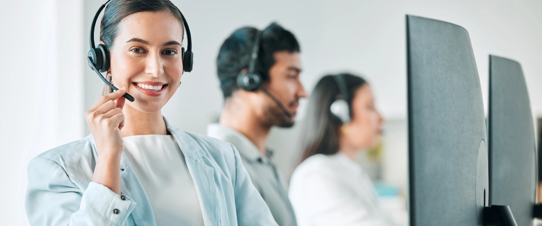 Customer service outsourcing team reviewing performance and cost metrics