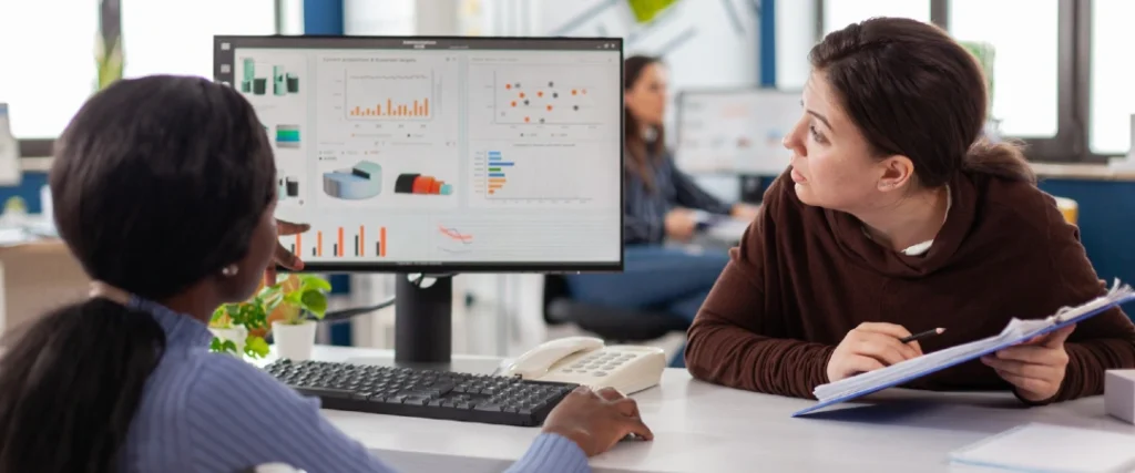SaaS customer support professionals reviewing customer churn and retention data