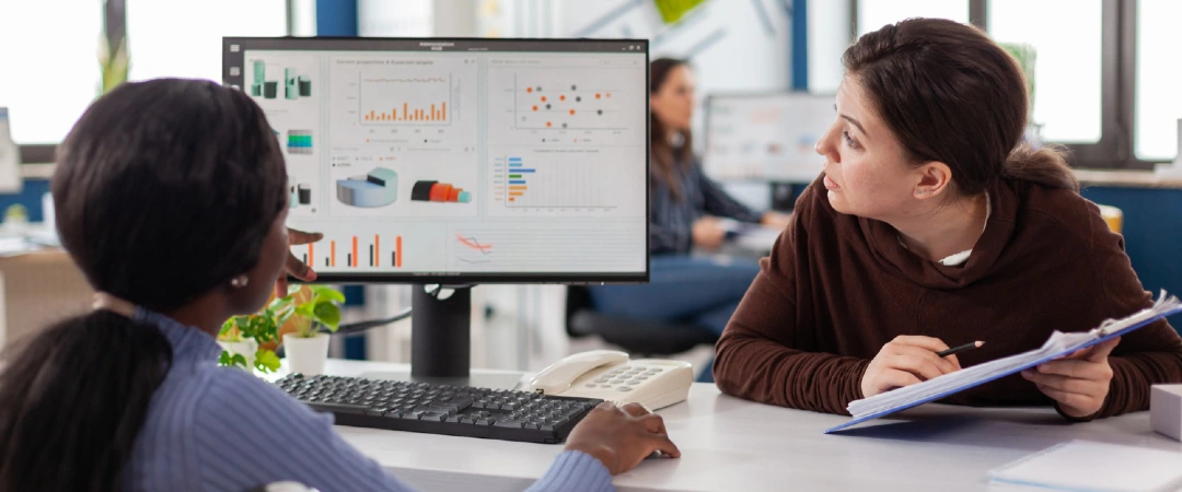 SaaS customer support professionals reviewing customer churn and retention data