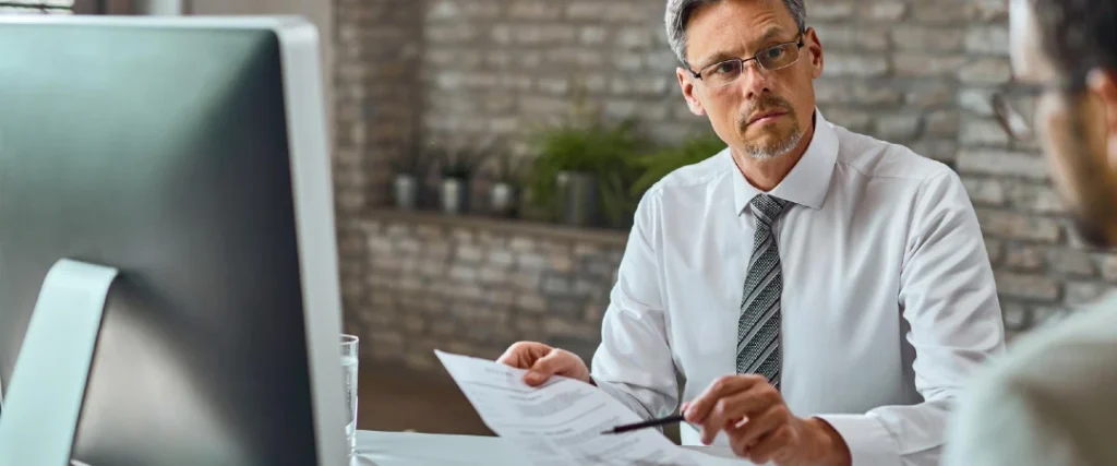 Loan officer reviewing documents during the loan processing workflow
