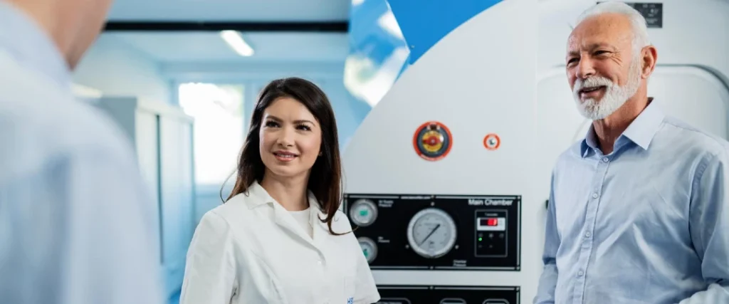 Healthcare professional discussing medical device use with a patient